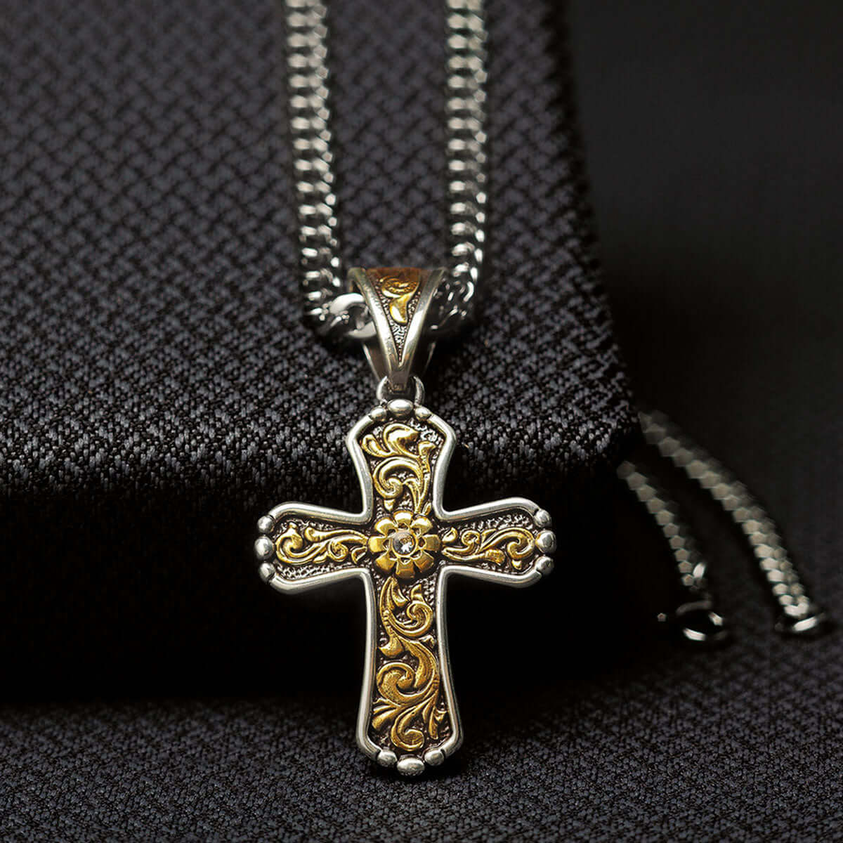 This Twister men's chain necklace features an antique gold floral scroll design on an antique silver cross. 22" long.