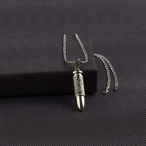 <span>The final touch to speak your person style and touch, created for the man who likes to look bold. Two-</span><span>inch bullet pendant with floral engraved design on a 24 inch chain that is hand engraved and has an antique shiny silver finish. Made in Mexico.</span>