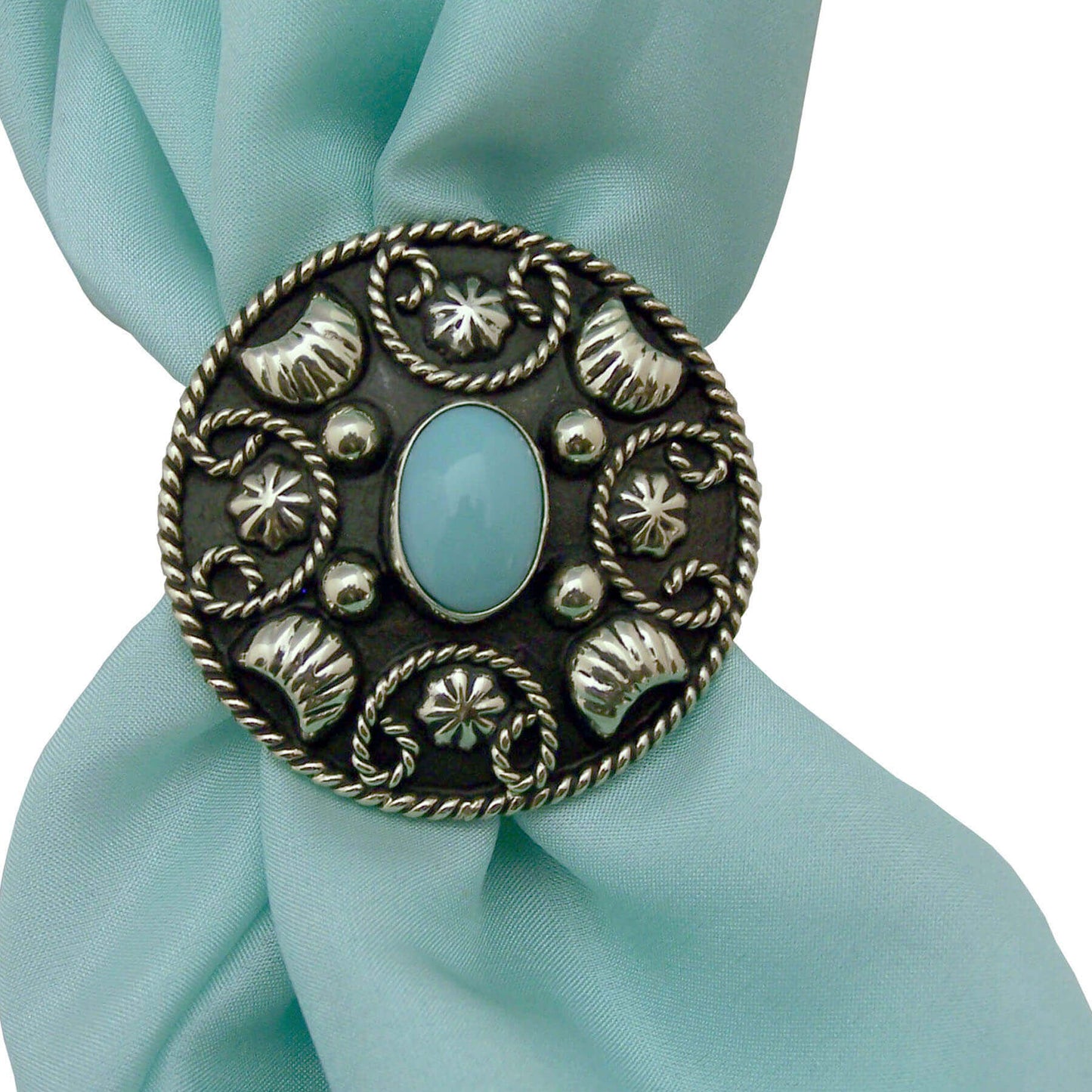 This scarf slide looks great on a western silk scarf or wild rag. It has a unique rope design surrounding an oval turquoise stone. Measures 1-1/2" diameter.