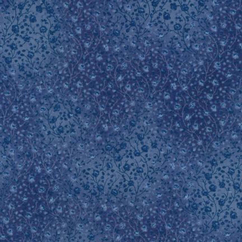 Blue floral pattern fabric with a vintage look, perfect for crafting or sewing projects.