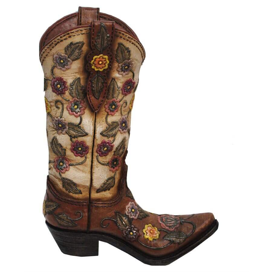 Adorned with a fun, fanciful design, this resin Flower Cowboy Boot Vase holds your artificial flowers with western style. The floral elements help to add a soft, feminine note for a twist on western elegance. Not intended for use with water. Hand painted, cast resin. Measurement: 13" x 9" x 3"
