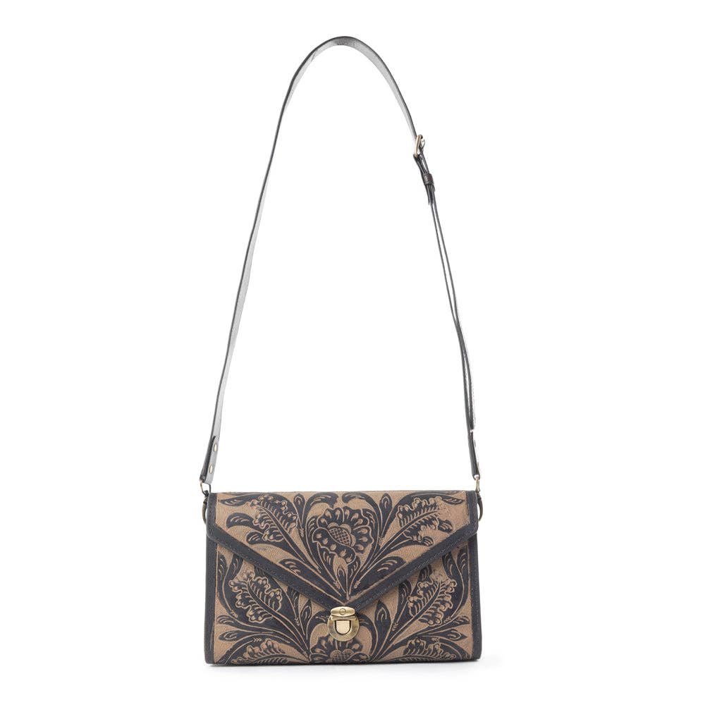Lark Hand Tool Ladies Western Purse featuring intricate hand-tooled floral patterns and a stylish shoulder strap.