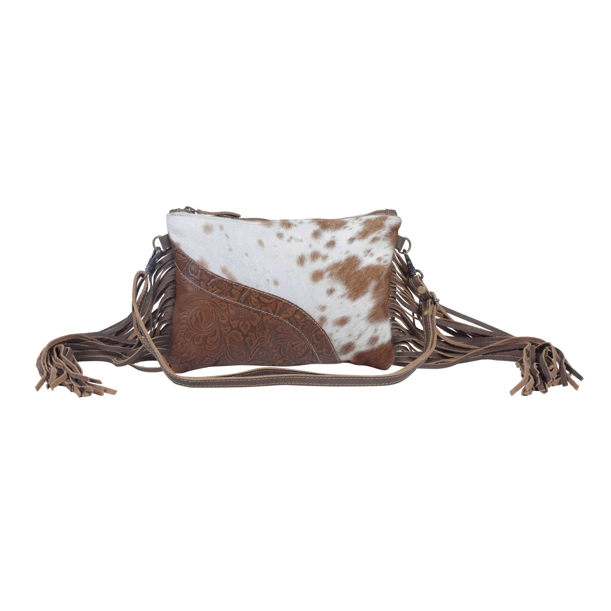 Brown and white cowhide leather bag with fringes on a white background