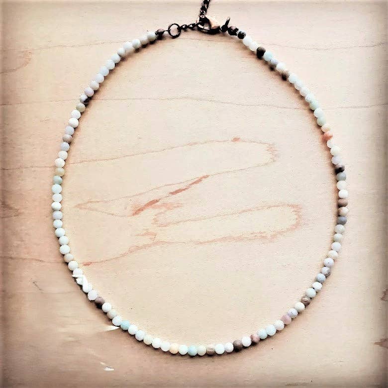 Necklace with small beads on a wooden surface