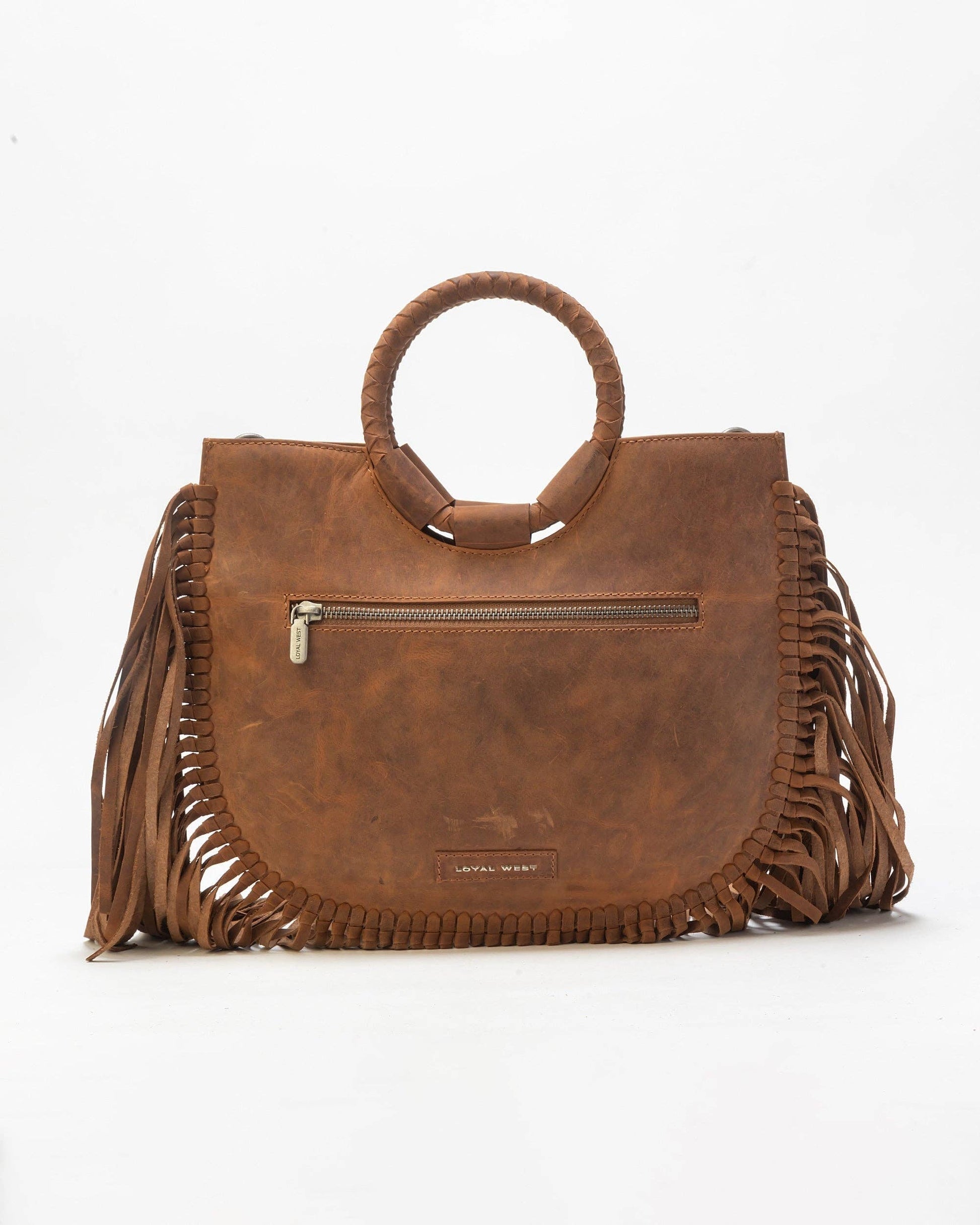 Brown leather handbag with fringe details on a white background