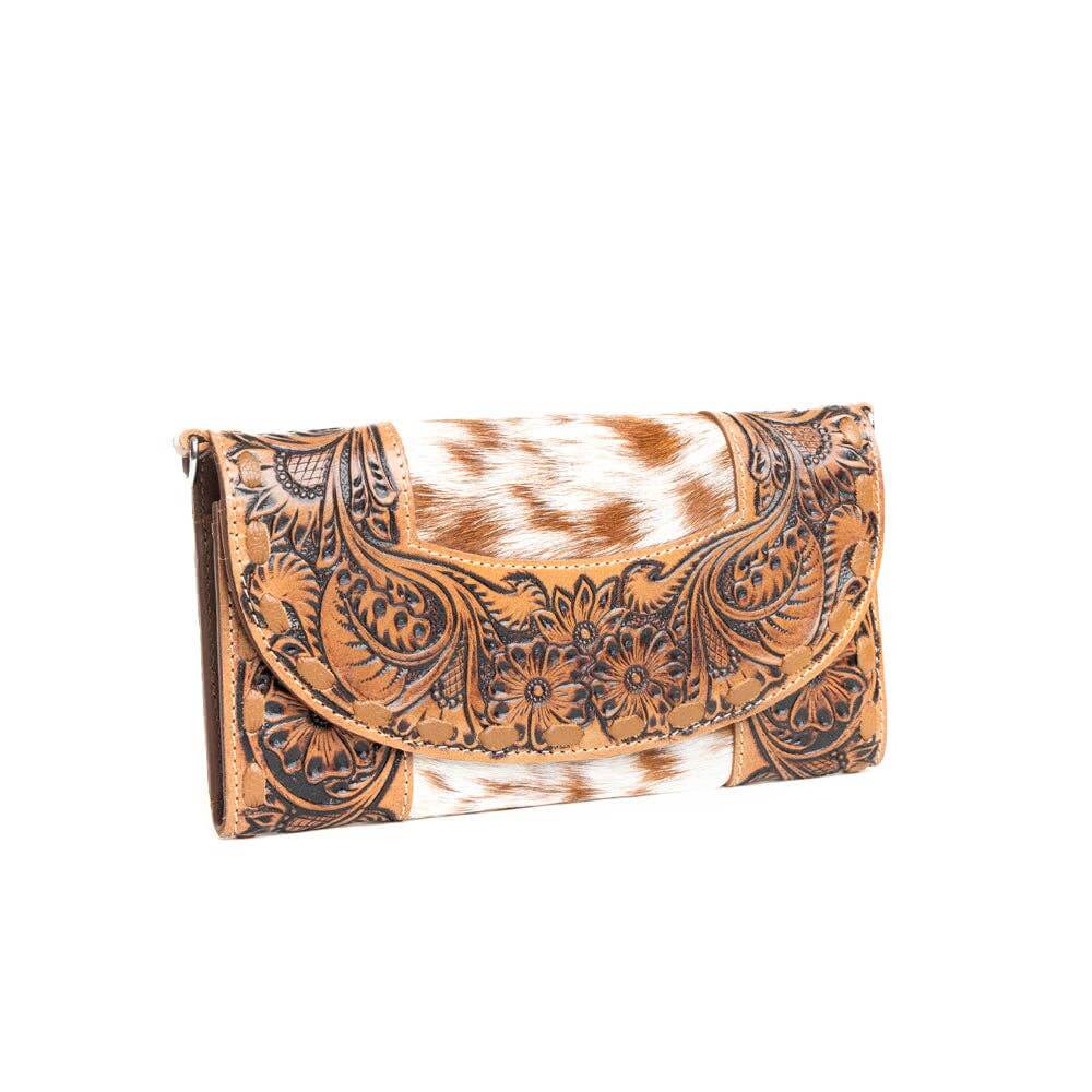 Cowhide clutch with intricate brown leather design on a white background