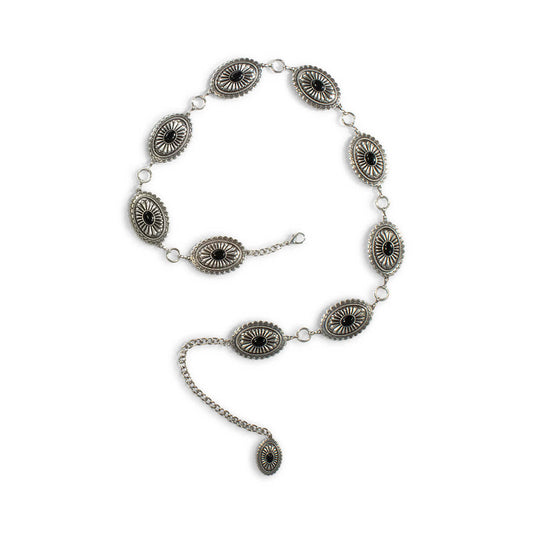 Silver concho belt with black accents on a white background
