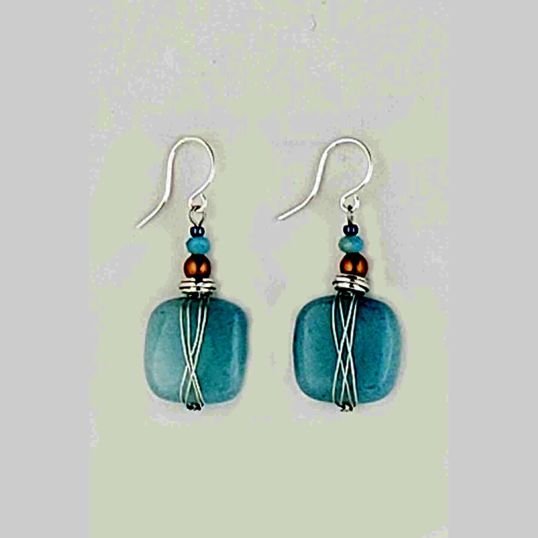 Harness the power of blue quartz to stimulate your imagination and free your mind. These earrings are the perfect accessory for artists, writers, and anyone seeking a boost of creative inspiration. Wear them daily to tap into your inner wellspring of ideas and bring your visions to life. Measures approx. .5" wide and 1″ from the base of hypo-allergenic ear wires. Each pair has its own unique features and the story of its properties on the card. Made in USA