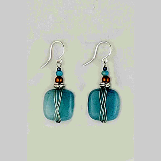 Harness the power of blue quartz to stimulate your imagination and free your mind. These earrings are the perfect accessory for artists, writers, and anyone seeking a boost of creative inspiration. Wear them daily to tap into your inner wellspring of ideas and bring your visions to life. Measures approx. .5" wide and 1″ from the base of hypo-allergenic ear wires. Each pair has its own unique features and the story of its properties on the card. Made in USA