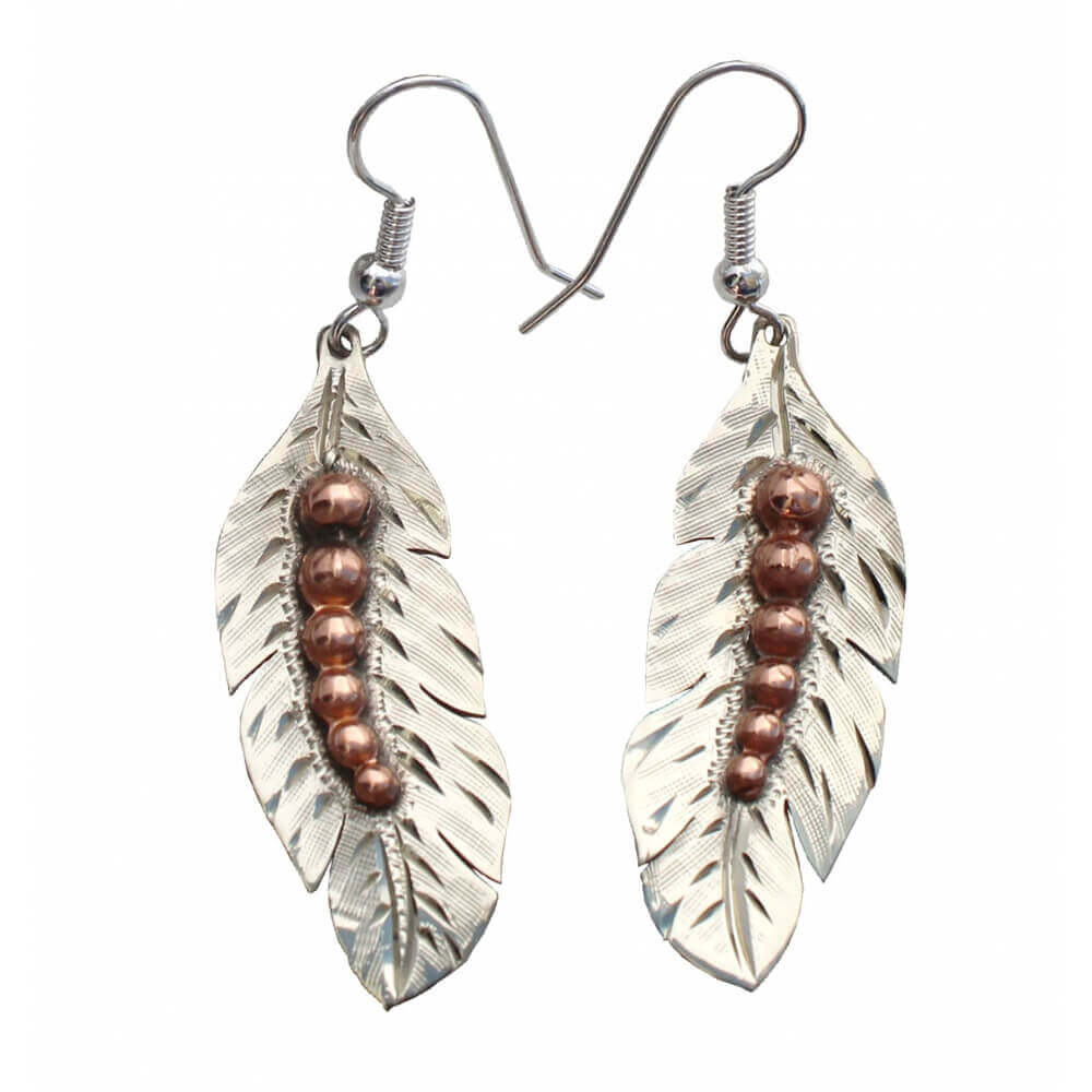Pair of silver leaf-shaped earrings with copper beads on a white background