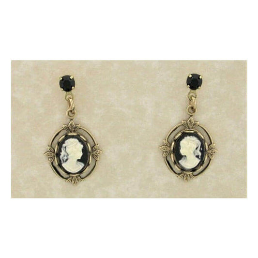Pair of vintage-style earrings with black and gold design on a beige card.