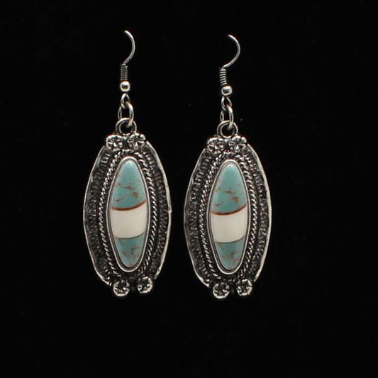 Antique silver setting with turquoise and ivory marbled stone in the center. French hook style. Ladies Western style earrings with silver and turquoise.
