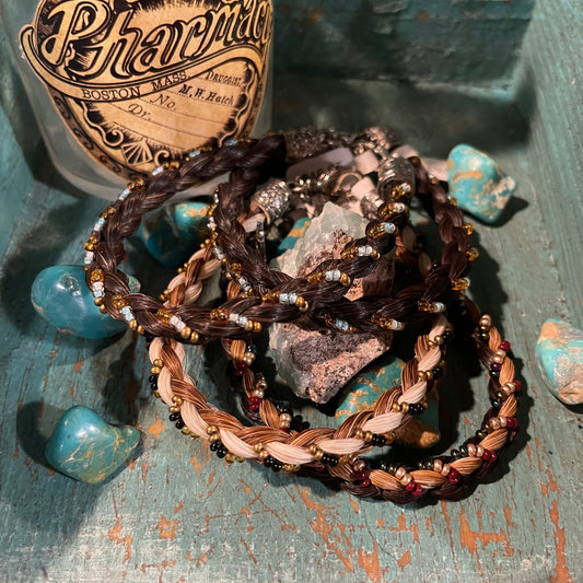 Braided Horsehair intertwined with tiny multi-colored beads that accentuate different horsehair colors. Comes in four different horsehair colors and the bead colors will vary. Buy one for each outfit or one for each of your friends.