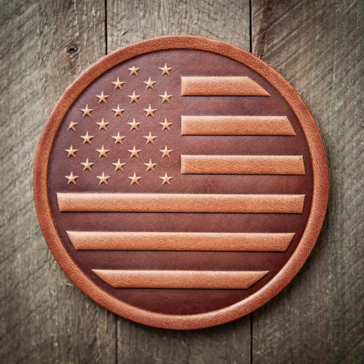 Leather American flag coaster on a wooden background