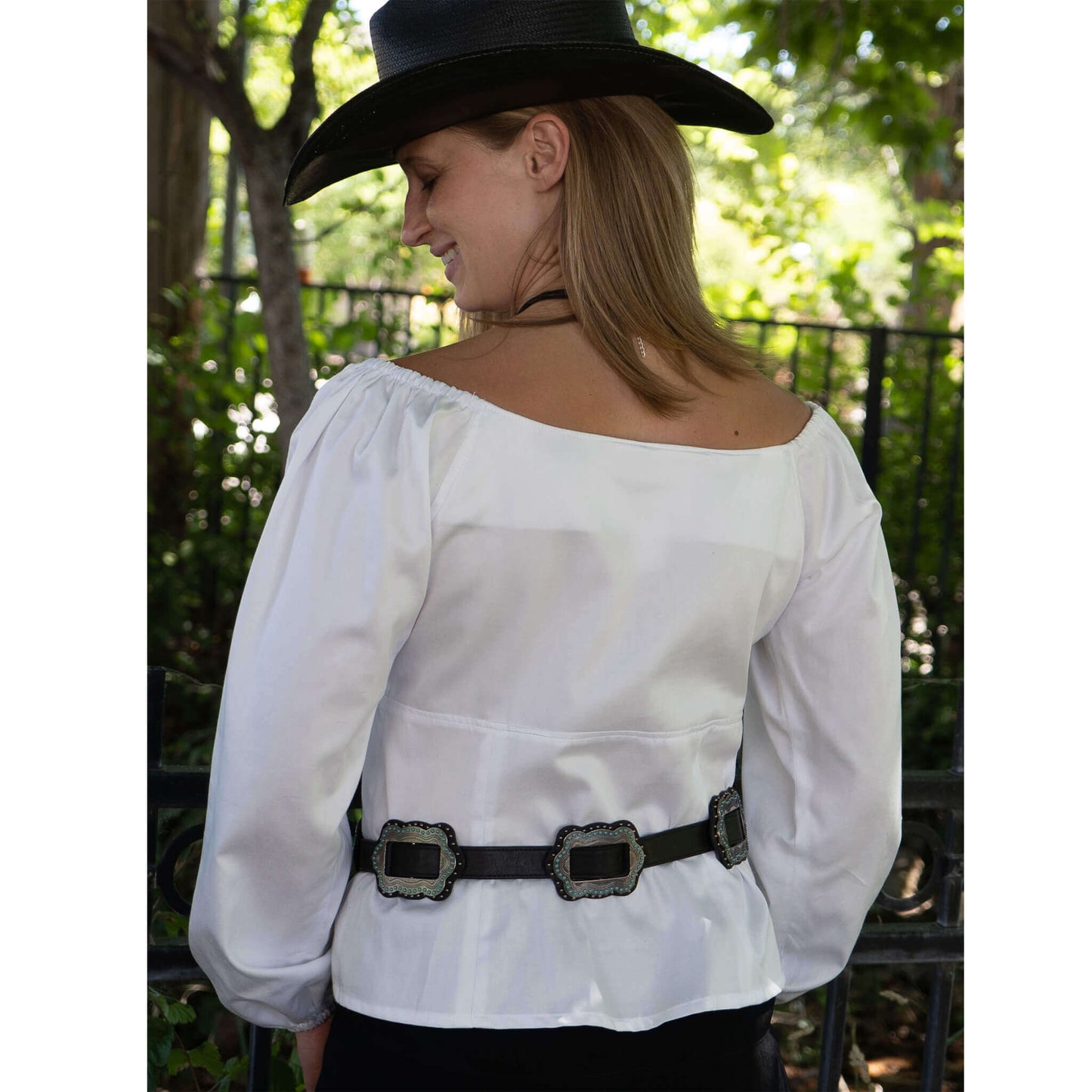 Model wearing the Mesa Cowgirl Western Blouse with off-shoulder sleeves, showcasing a sweetheart neckline and stylish belt.