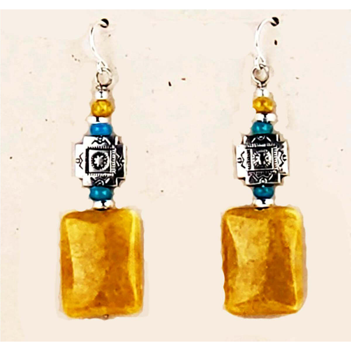 Mustard Jasper is a combination of Chalcedony and Quartz.&nbsp; Measures approx. .50″ wide and 2″ from the base of hypo-allergenic ear wires. Each pair has its own unique features. Handcrafted in USA