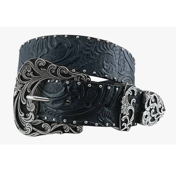 A black tooled leather belt with intricate silver engraved scrollwork on the buckle, keeper, and tip, accented with silver studs, shown on a light gray background.