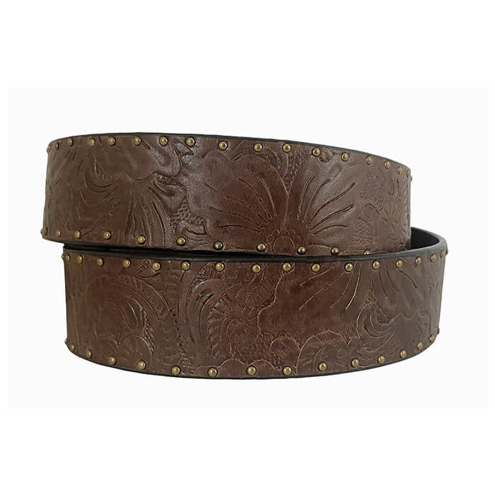 A brown tooled leather belt with floral embossing and brass studs, coiled on a white background.