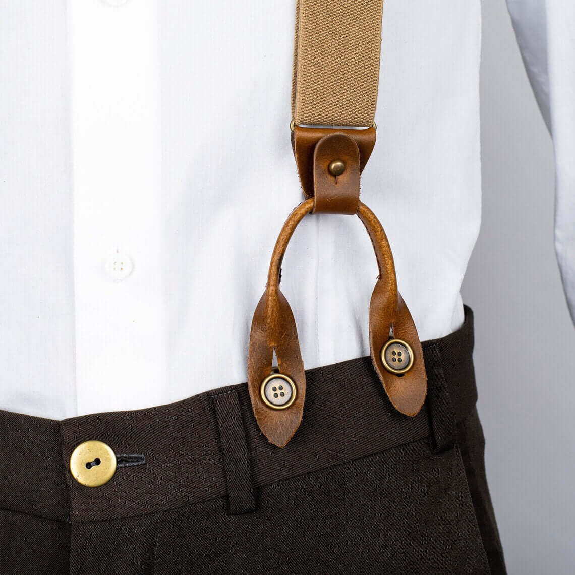 No-Sew Removeable Buttons for Suspenders attached to stylish brown suspenders on white shirt and dark pants.