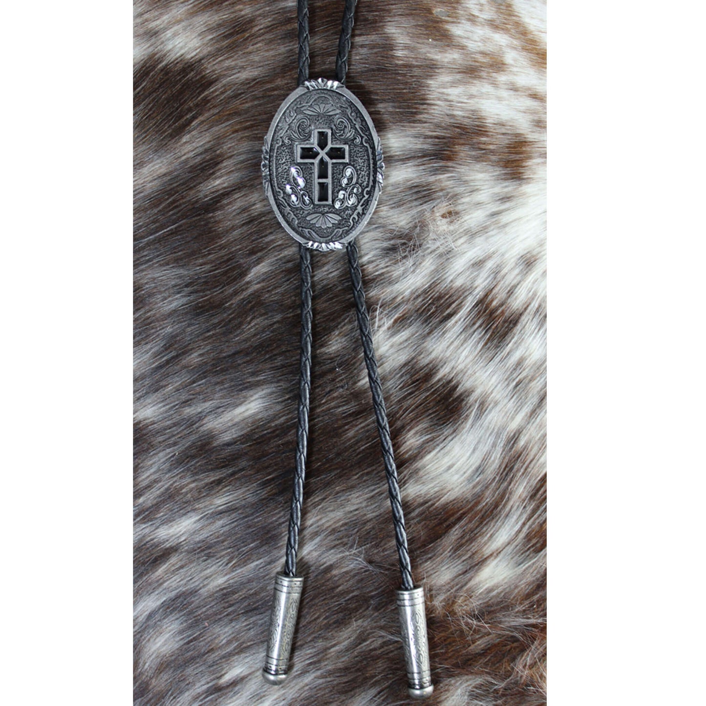 Bolo tie with decorative clasp on a fur background