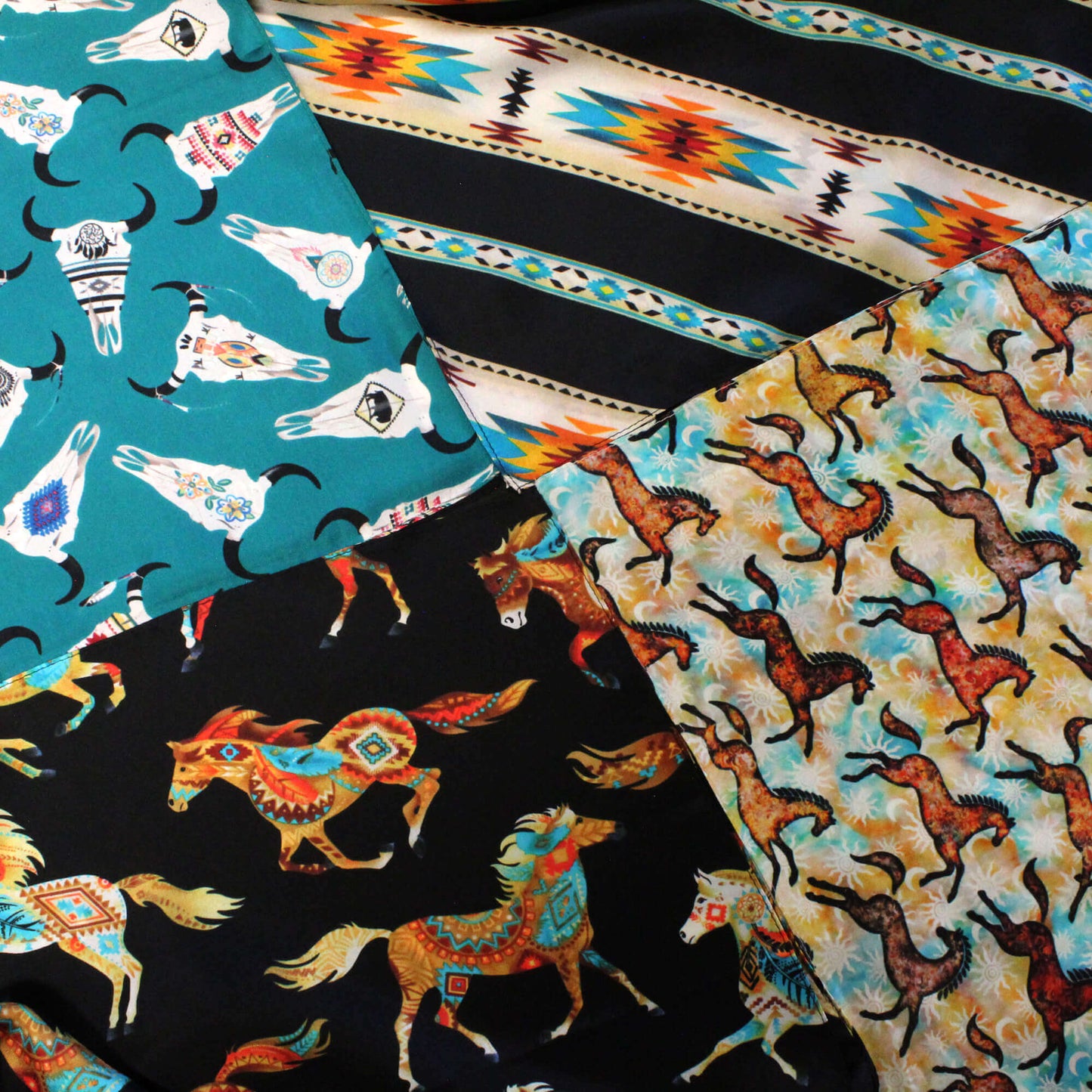Collection of fabric swatches with animal patterns including horses and  cow skulls