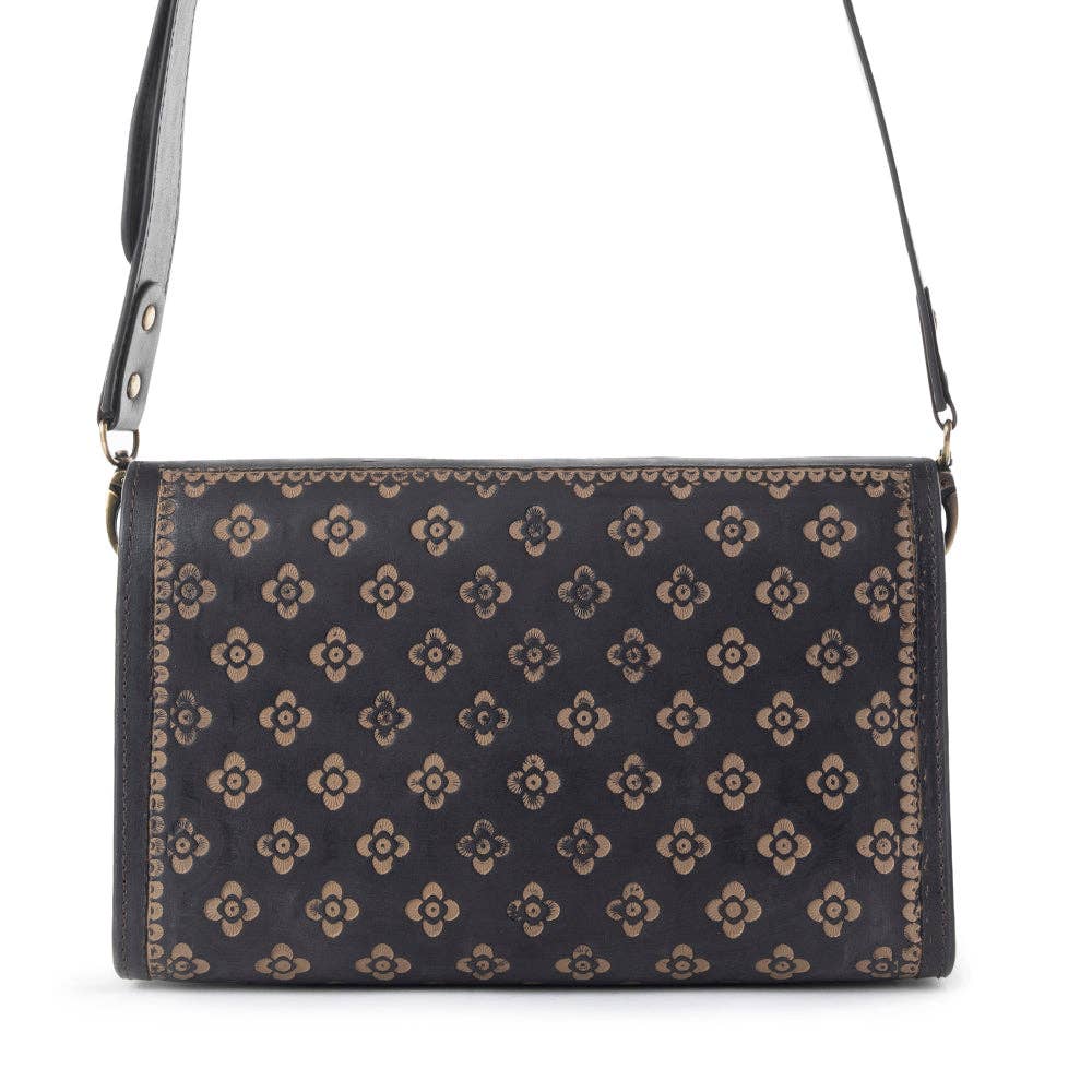 Lark Hand Tool Ladies Western Purse with intricate floral patterns on a leather surface, showcasing Western craftsmanship.