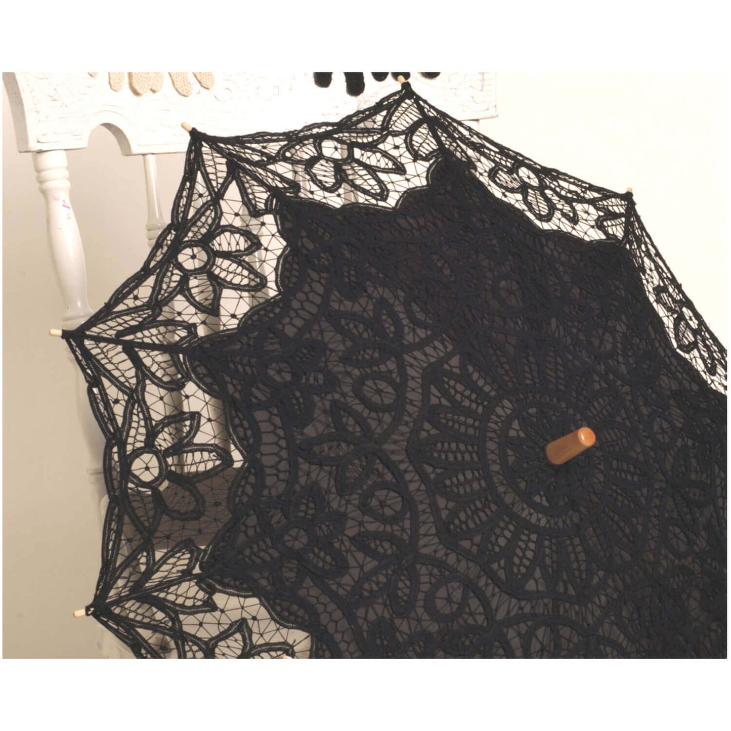 Ladies Western Victorian Lace Parasol in elegant black lace with decorative floral patterns and a wooden handle.