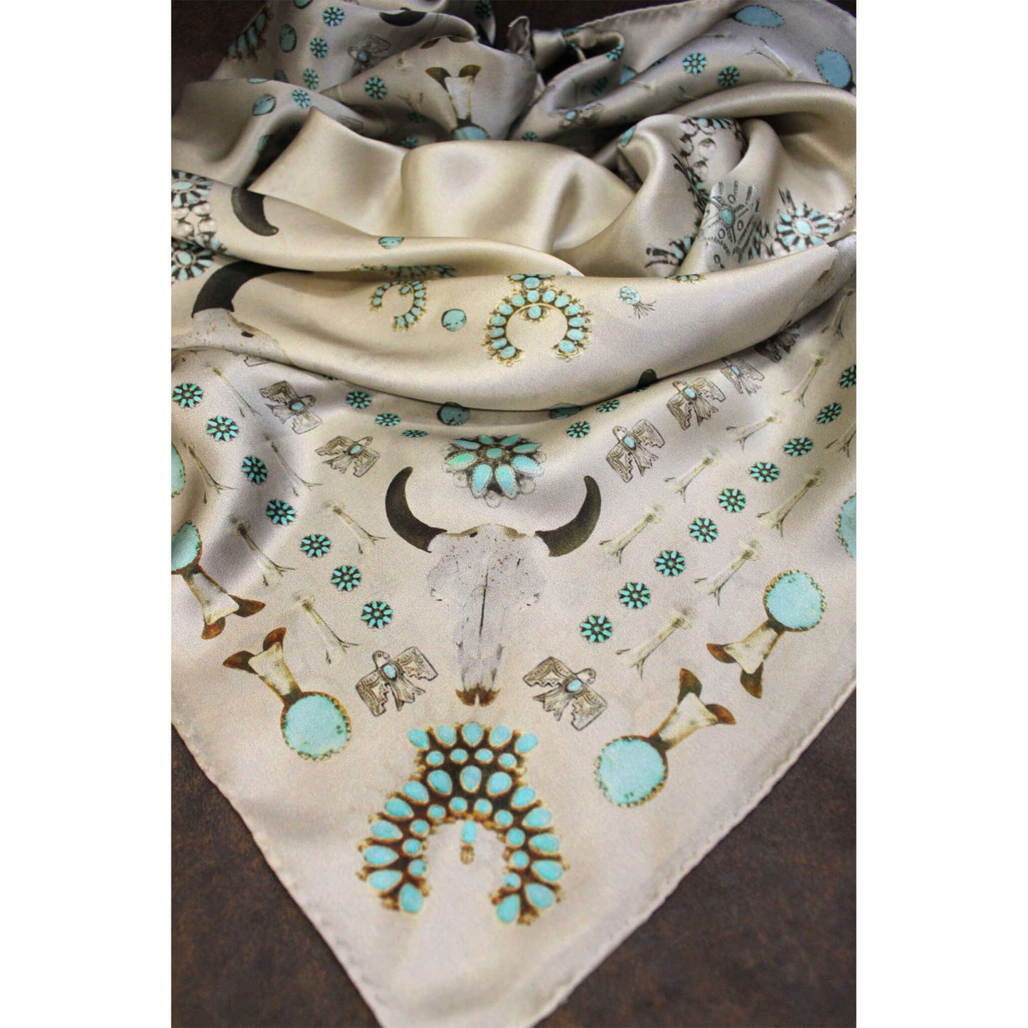 Scarf with bull skull and turquoise designs on a white background